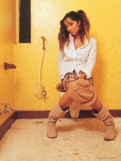 Styled to stand out. A fun and quirky shot of Anusha Dandekar for the clothing brand Rouge, playing with an unconventional setting to create a memorable image.
