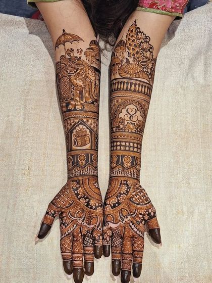 A grand bridal design with elephants and doli.