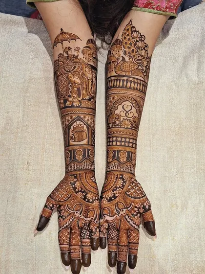 This design features a baraat scene with an elephant on the arm, along with other traditional motifs like peacocks and hearts.