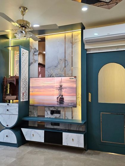 Who says a TV unit can’t be a statement piece? This unique design combines a TV unit with an integrated temple, all in a bold teal and marble finish.