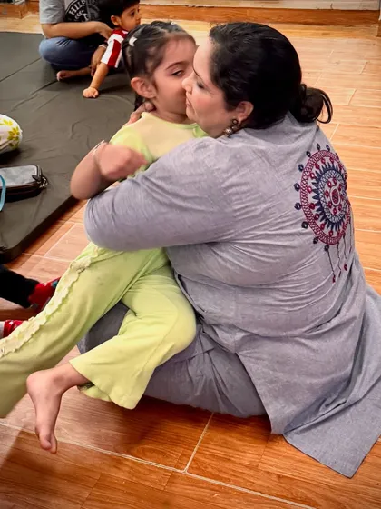 A gentle kiss and a hug from a student. We pride ourselves on building strong, trusting relationships with each child in our care.
