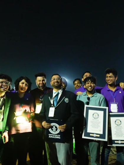 A Guinness World Records official stands with our team, validating the five records we broke. This image is a powerful endorsement of our technical capabilities.