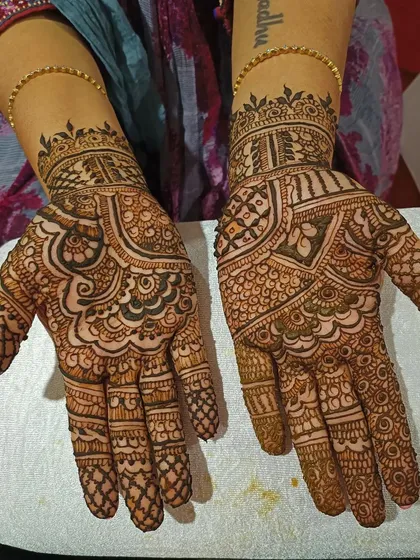An example of a full bridal mehendi design covering both palms, created with my henna cones. The pattern is dense and traditional, featuring classic motifs perfect for a wedding ceremony. The dark, even stain demonstrates the quality you can expect for significant events.