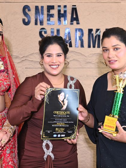 Another shot of our winner with her model. The trophy is a symbol of her outstanding performance.