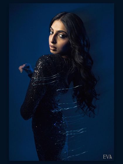 A portrait from behind, with the model looking over her shoulder. The motion blur effect on her back adds a layer of intrigue and sophistication to the image.