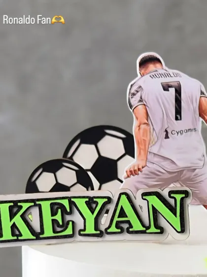A detail shot of the Ronaldo-themed cake, personalized with the name 'Keyan'. Perfect for a young football enthusiast.