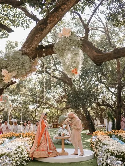 A wedding ceremony should feel like it’s floating on air. For Aashna and Armaan, we created a circular aisle enveloped by an ombré wave of thousands of roses, with baby's breath clouds hanging from the trees above. This was the setting for their sand ceremony, a beautiful symbol of two lives blending into one.