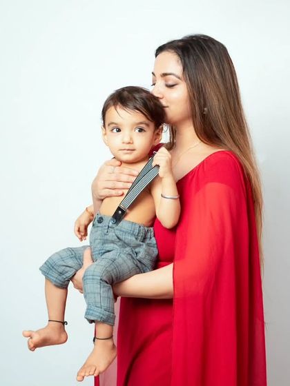 A mother's tender kiss for her son. These simple, loving gestures make for the most beautiful and timeless photographs.