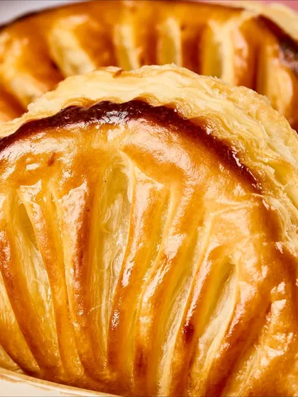 A close-up of the golden, flaky crust of our Diwali gujiyas.