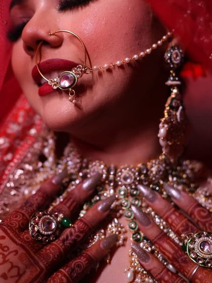 A detailed shot of the lips, nose ring, and jewelry. Every element is carefully considered to create a cohesive look.