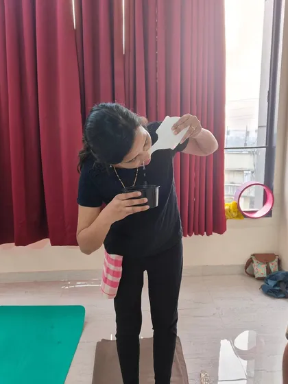 A student practices Jalneti, a nasal cleansing technique using a neti pot with saline water. This is one of the first and most important kriyas we teach to help clear the nasal passages and prepare the body for deeper pranayama.