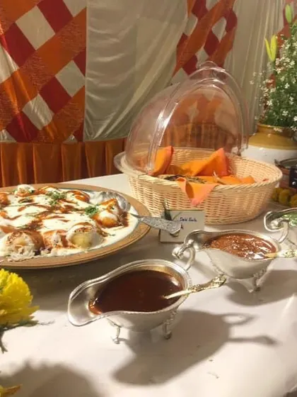 A close-up of the Dahi Bhalla station from the Kirtan event. Served with sweet and tangy chutneys in elegant silver gravy boats, it was a favourite among the guests.