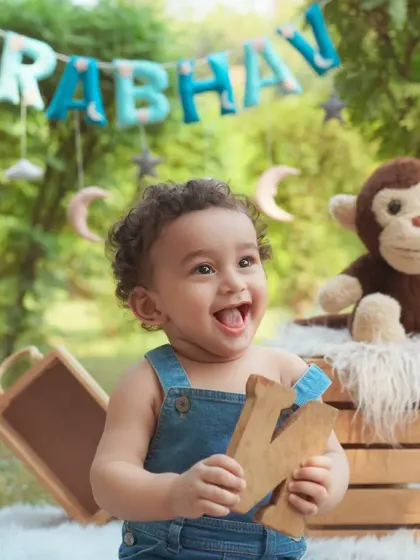 The pure, unfiltered joy of a baby's first birthday celebration outdoors. We set up everything to capture these priceless, happy expressions in beautiful natural light.