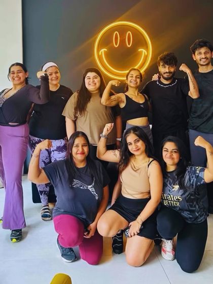 Flexing those hard-earned muscles. The strength you see here isn't just physical; it's the strength of a community that pushes and supports one another to be their best.