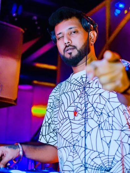 A confident point to the camera. When you understand the game of life, no one can predict your next move.