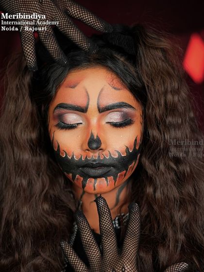 This look shows how to combine glam eye makeup with spooky SFX details for a unique Halloween transformation.