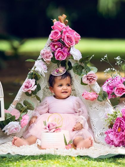 A lovely portrait with her birthday cake, enjoying the fresh air and beautiful surroundings.