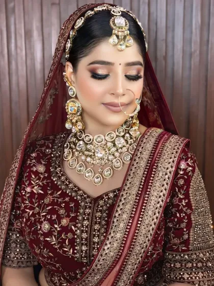 A serene portrait showing the bride with her eyes closed, emphasizing the beautiful blend of eyeshadow and the clean finish of her makeup.