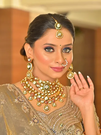 A close-up of the grey saree look, showing the intricate jewelry and the perfectly executed makeup.