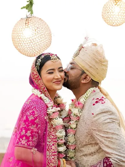 A sweet kiss on the cheek under the floral mandap. These are the tender, unscripted moments that I love to capture during the wedding ceremony.