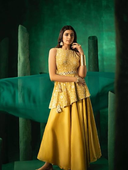 A full-length shot of the Organza Flared Sharara set from 29 India against our custom green set.