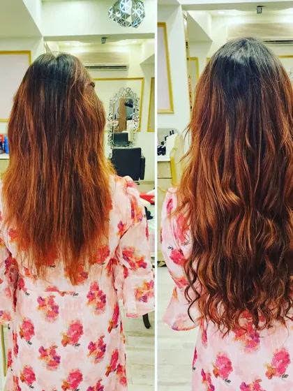 We enhanced her natural reddish tones and added volume with extensions. The soft waves give her hair a fuller, more dynamic look with beautiful texture.