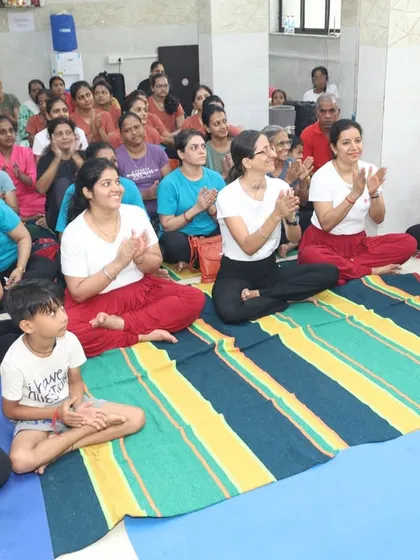 The happy faces of our participants after a fulfilling yoga session. The smiles and applause reflect the joy and sense of community that we cultivate in our studio classes.