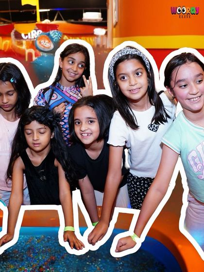 Playtime, but make it first-class. A group of friends gathers around one of our sensory play stations, enjoying an extraordinary setting for their everyday fun.