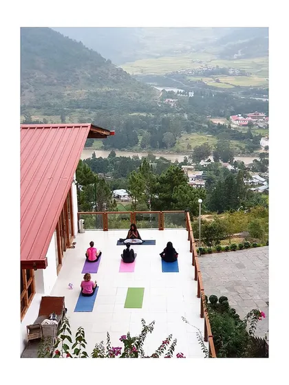 A glimpse into our morning practice during a wellness retreat in Bhutan. We gather on a terrace with an open view of the Punakha valley and its winding rivers. Leading a group yoga session in such a majestic space allows us all to connect more deeply with our breath and each other.