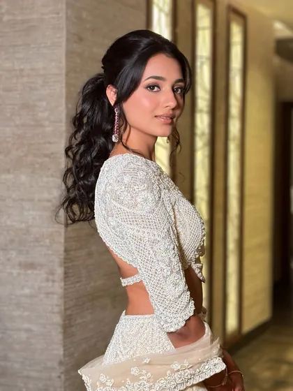 Another angle of Kopal's chic reception look. The hairstyle perfectly shows off the back of her stunning blouse.