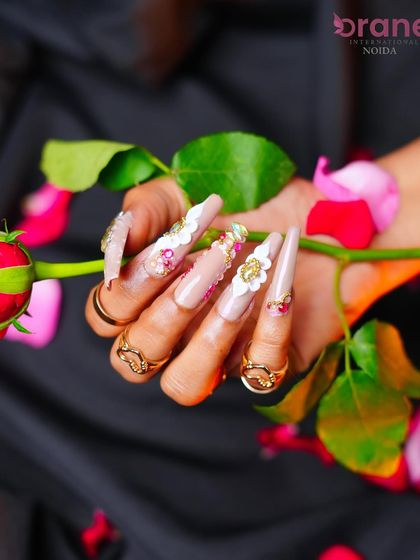 A beautiful shot that captures the delicate and intricate details of the floral nail art.