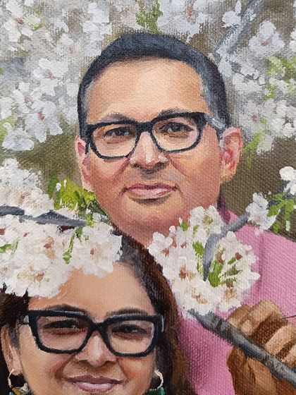 Close-up of the husband in the cherry blossom portrait.