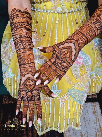 A beautiful back-hand design for an NRI bride from the US, featuring intricate patterns that perfectly complement her front design.
