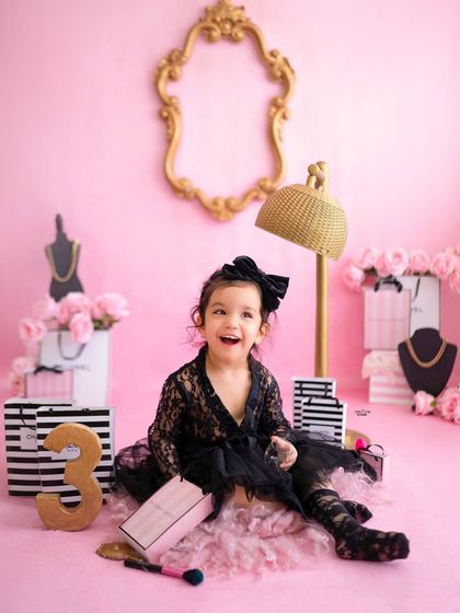 A big, happy laugh that lights up the whole room. A perfect candid moment from her glam shoot.