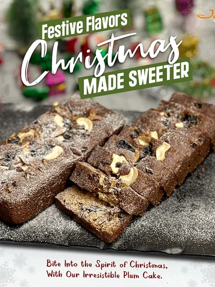 Experience the taste of Christmas with our classic plum cake. This image captures two rich, dark fruit cakes, generously topped with cashews and dusted with powdered sugar, promising a moist, flavorful bite that embodies the holiday spirit.