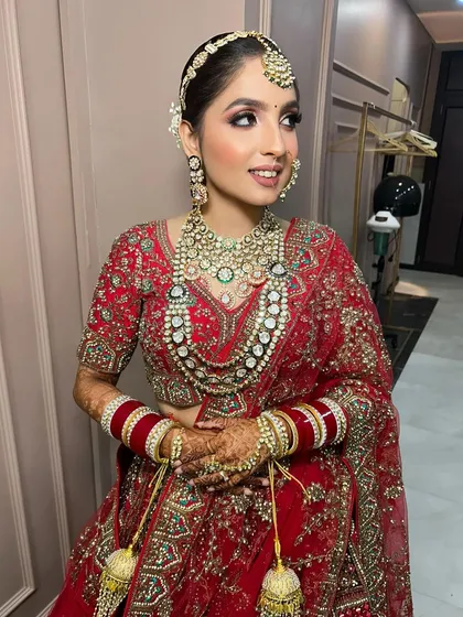 A side profile of the bride, showing her elegant hairstyle and the beautiful details of her jewellery.