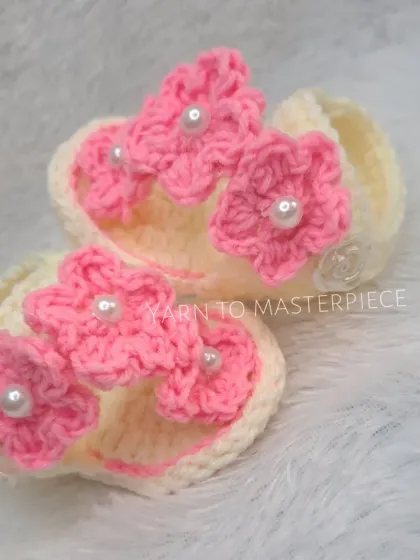 My summer sandals in off-white, adorned with three beautiful pink flowers, each centered with a pearl.