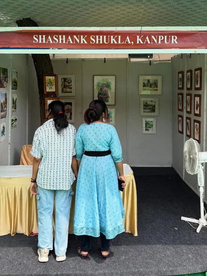 A collection of photos from various art exhibitions and fairs I've participated in, including the National Exhibition of Art and the Jaipur Kala Mela. It's an honor to have my work displayed in these prestigious venues.