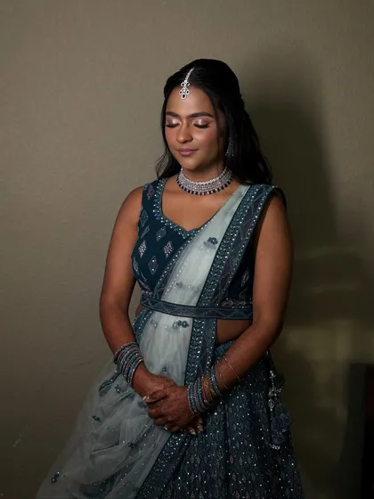 A serene, full-length portrait, her posture elegant and her look complete.