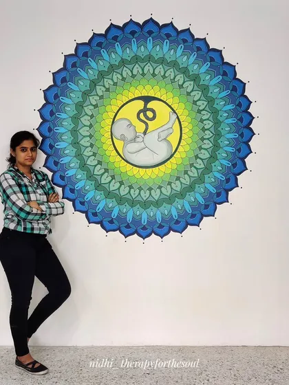This large-scale fetus mandala was a special project for a fertility hospital in Bangalore. Standing next to the finished piece shows the impressive size and intricate detail involved in creating a powerful, meaningful centerpiece for a space.