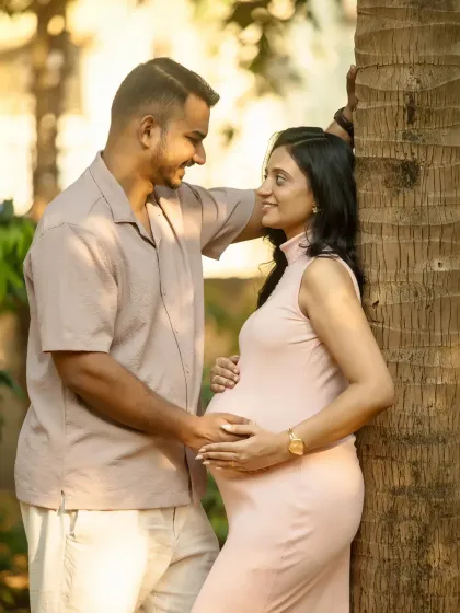 A relaxed and happy portrait by a tree. The natural setting provides a beautiful, serene backdrop for capturing your love story.