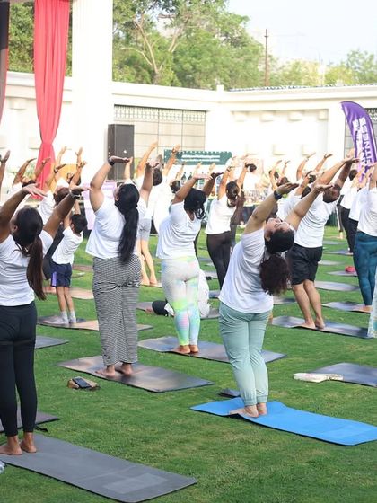 Participants in our outdoor yoga session, stretching in unison. Practicing together in nature adds a special element of peace and connection.