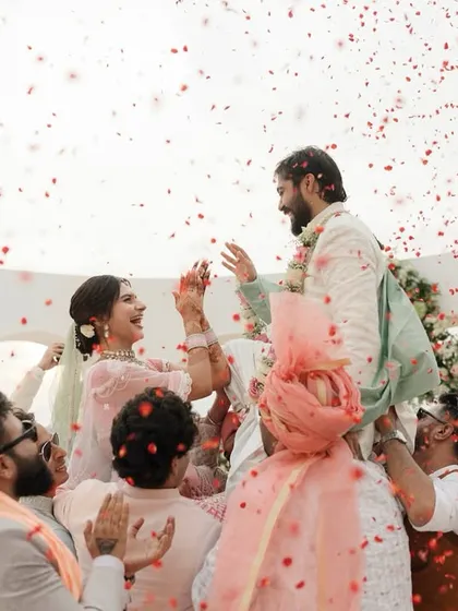 The pure, unadulterated joy of the jaimala ceremony, where friends lift the couple up in celebration. These are the candid, high-energy moments I love to facilitate.