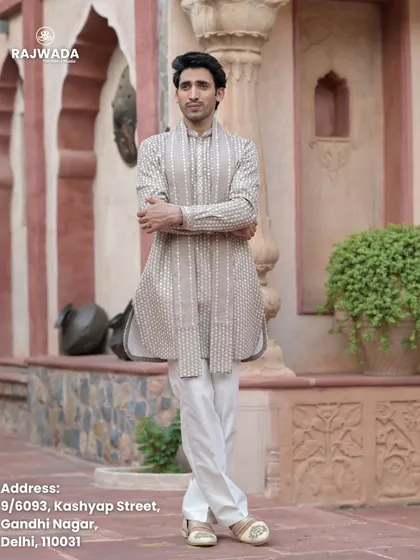 The model strikes a confident pose in the beige printed kurta. This image showcases the comfortable fit and timeless appeal of the Riwayat collection.