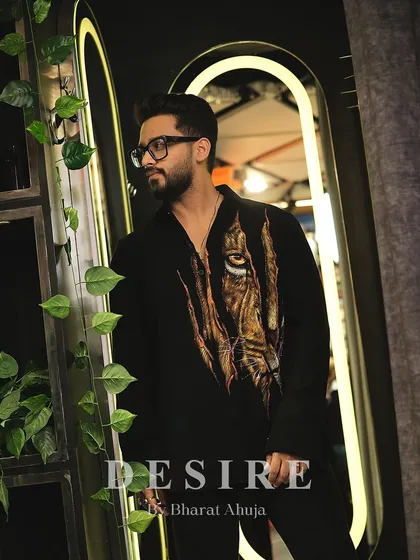 Own the spotlight in this bold designer shirt. The striking tiger print is all about fierce fashion and timeless masculine elegance.