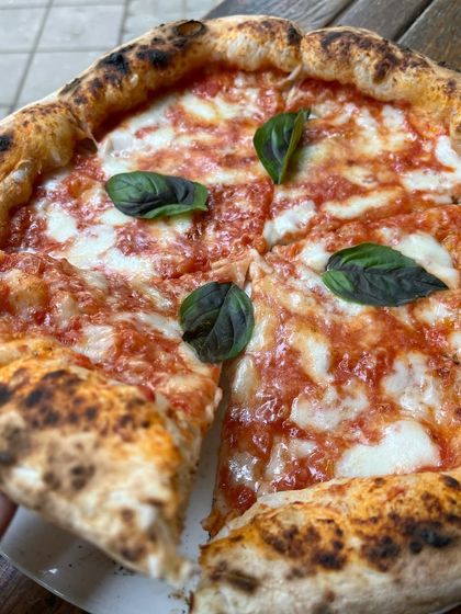 The first slice of a Margherita is always the best. Who are you sharing it with?