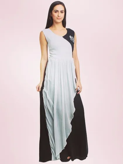 This image showcases a dual-color maxi dress from a pret-a-couture collection. The styling is minimal to draw attention to the unique color-blocking and draped silhouette, making it an effective image for an online store.