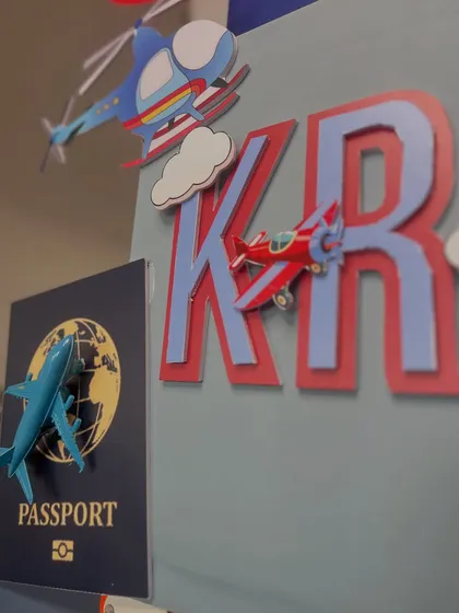 A close-up on the personalized details, including the 'Krishna' name cutout and the custom 'Passport' element, making this gift uniquely his.