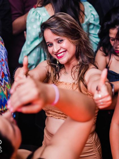 A guest giving a double thumbs-up.