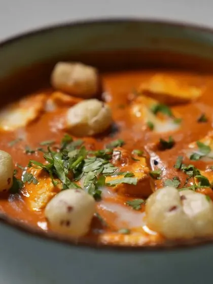 A close-up of our Paneer Makhana Masala, garnished with fresh coriander. You can see the soft paneer and puffy makhana mingling in the rich, spiced gravy.